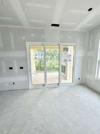 TRIPLE SLIDING DOOR OUT TO COVERED PATIO