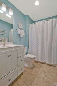 Full bath up with tile floor and tub/shower combo.