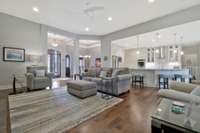 View of Family room toward the kitchen.  Great home for entertaining.  Lots of recessed lighting.