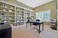 Need a home office?  This one is huge with gorgeous windows and plenty of bookcases.