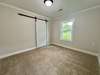 Master Bedroom with walk in closet and barn door.