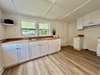 Love the cute kitchen with butcher block counter tops and  bead board walls.   Stove is on it's way!!!