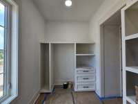 Walk-in hidden pantry with opening and plug for future second fridge