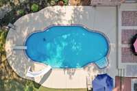 Isn't this pool beautiful! No cookie cutter pool or patio area