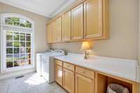 Can you imagine having this much space in your laundry room? It even has a shower!