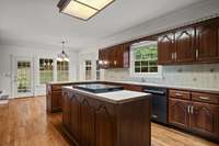 Discover this expansive kitchen, offering abundant space for all your culinary endeavors and ready to be transformed through renovation!