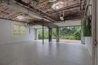 Another captivating view of the garage area featuring brand new sleek epoxy flooring. Elevate your space with this modern upgrade!