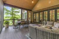 Serene screened in back porch with beautiful views.