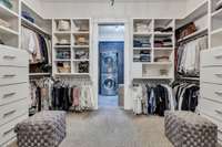 Custom built closet opening to the laundry room.