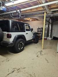 Over sized garage in basement. Room for your vehicle plus.