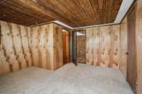 upstairs bedroom 4 with tongue and groove ceilings and walls