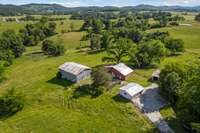 aerial view of barns and garage