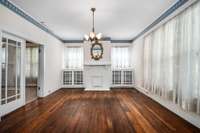 formal living room with built in curio cabinets