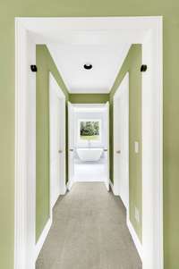 Down the hall are two separate walk-in closets and a new primary bath.