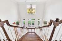 The view from the top of the stairs to this gracious foyer.