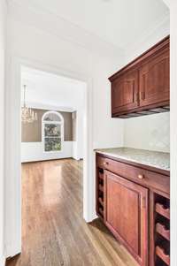 And here is the butler's pantry with granite counter and plenty of storage and wine racks.