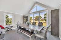 The family room and dining room are one open large space with vaulted windowscapes on each end.