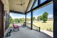 What a fabulous covered front porch!  Custom designed by the current owners the tall ceilings and imaginative architecture are mirrored in the rest of the house.