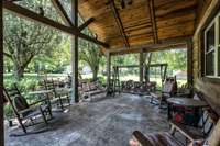 A frame ceiling over decorative concrete patio overlooking the fish pond/waterfall