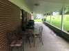 Covered large back porch .  Sit outside and listen to the rain with your favorite beverage