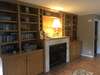 Entire wall has custom built in bookcases/shelves for your collectibles or decor