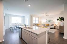 Kitchen and Bath will have white quartz countertops.