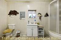 Horse barn with 2 wash bays, tack room, mechanical storage and trainer's quarters with bath