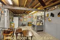 Horse barn with 2 wash bays, tack room, mechanical storage and trainer's quarters with bath