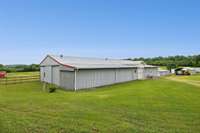 Horse barn with 2 wash bays, tack room, mechanical storage and trainer's quarters with bath