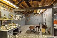 Horse barn with 2 wash bays, tack room, mechanical storage and trainer's quarters with bath