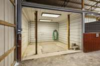 Horse barn with 2 wash bays, tack room, mechanical storage and trainer's quarters with bath