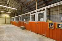 Horse barn with 2 wash bays, tack room, mechanical storage and trainer's quarters with bath