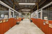 Horse barn with 2 wash bays, tack room, mechanical storage and trainer's quarters with bath