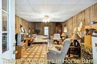 Horse barn with 2 wash bays, tack room, mechanical storage and trainer's quarters with bath