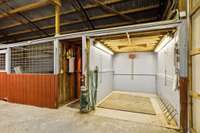 Horse barn with 2 wash bays, tack room, mechanical storage and trainer's quarters with bath