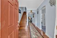 Enter into the foyer and hardwood floors