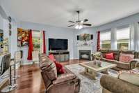 Entry Level Family Room features gas Fireplace and Open Floorplan