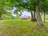 From the farmhouse overlooking the barndominium at 179 Wild Cherry Ln.