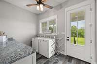 Laundry room overlooks the backyard.