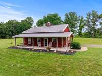 A cozy barndominium at 179 Wild Cherry Ln on 20.63 acres.