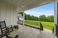 The covered patio overlooks the gorgeous views of the backyard. Perfect spot to watch wildlife roam.