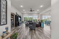 Front entry looking into the family room. Wood patterned tile floor throughout the main level of the home.