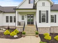 Board & Batten style exterior siding w/ shutters and Tennessee limestone. Underground utilities to the home.