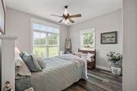 Front guest bedroom with a full bathroom (tub/shower combo and marble countertops).