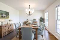 Virtually staged. Dining room