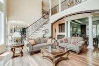 BALCONY OVERLOOKING LIVING ROOM SPACE