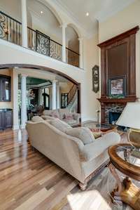 LIVING ROOM WITH FIREPLACE, LARGE WINDOWS WITH STUNNING VIEWS OF THE BEAUTIFUL TENNESSEE HILLS