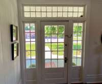 Original front door with transom windows.