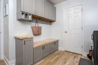 Mudroom/ Drop zone with storage. Perfect for those muddy shoes and allows organization for your daily items when coming and going.