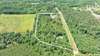 Aerial view of entire property. Home sits on bottom side of this photo